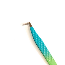 Load image into Gallery viewer, A pair of green and blue lash tweezers with precision tips, placed on a light blue surface.