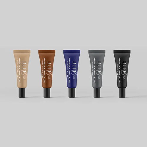 Five skincare tubes with different colored caps on a light gray background