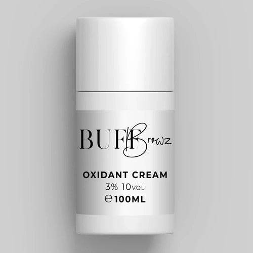 White container of BUF Browz Oxidant Cream on a gray background