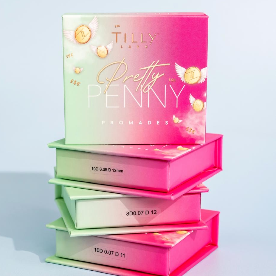 Boxes of false eyelashes stacked on top of each other with branding visible on the packaging.