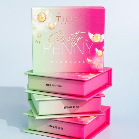 Boxes of false eyelashes stacked on top of each other with branding visible on the packaging.